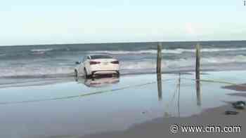 Florida man in apparent medical distress crashes car through beach crowd before hitting the water - CNN