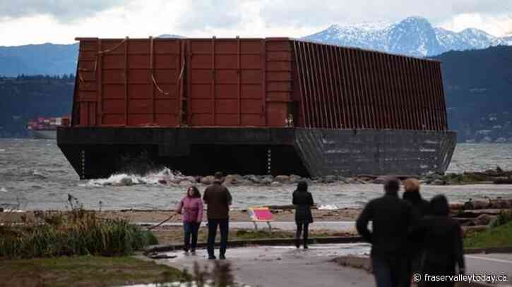 Salvage work begins to remove barge stuck for months on Vancouver beach