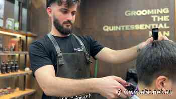 In a job market that favours workers, this barber shop is flying in staff from interstate
