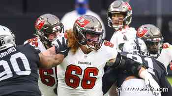 Bucs center Jensen carted off with knee injury