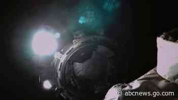 China spacecraft returns amid booster rocket concerns