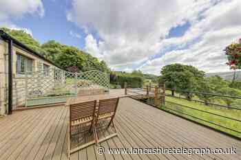 Home has a cinema room, hot tub, and looks out onto the finest views