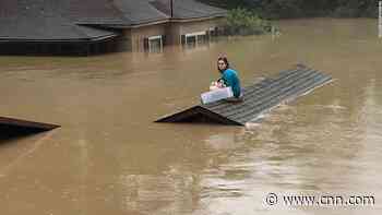 A teen saved dog in Kentucky floods and waited for hours on a roof to be rescued
