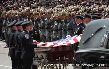 Thousands mourn slain Rochester police officer
