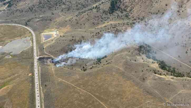 Drivers warned to expect delays as wildfire sparks near Highway 1 in B.C. Interior