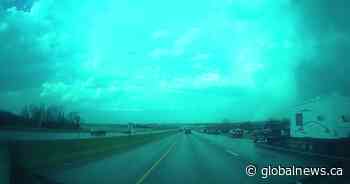 Severe Alberta weather leaves cars damaged, lined up along the highway