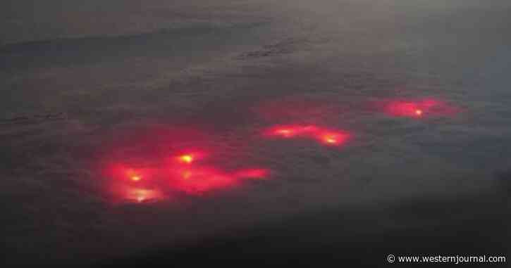 Pilot Captures Mysterious Red Glow Lurking Beneath the Clouds Unlike Anything He's Ever Seen