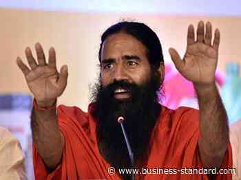 Coronavirus vaccines not effective without yoga, Ayurveda: Ramdev - Business Standard