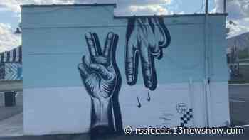 Artist paints 'Peace Virginia' mural in Virginia Beach's ViBe District