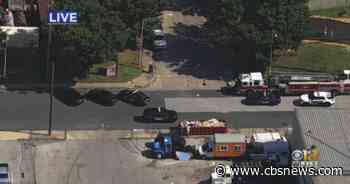 Police responding to workplace shooting in Southwest Baltimore, suspect at large - CBS News
