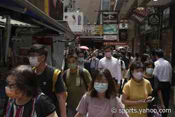 Hong Kong cuts coronavirus hotel quarantine for arrivals to 3 days - Yahoo Sports