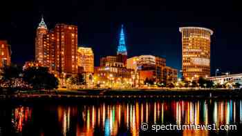 Lights at Terminal Tower beam bright lighting the night sky - Spectrum News 1