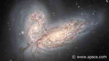 'Cosmic butterfly' wings shimmer in image of violently colliding galaxies