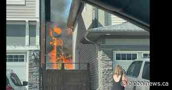 Airdrie emergency crews fight to contain residential structure fire