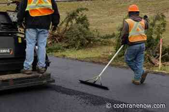Paving begins near the Jack Tennant Memorial Bridge - CochraneNow.com