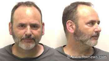 Rhode Island man arrested after driving around Providence with woman stuck on hood of car, police say - Fox News