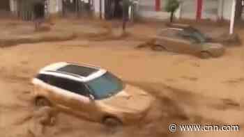 Watch flooding in northern China sweep away cars