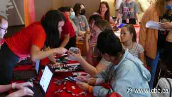 Newly arrived Ukrainians get health, bank, ID cards at Regina hotel