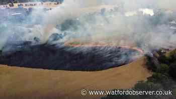 Field on fire in Tolpits Lane as police say avoid area