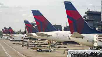 Former flight attendant sues Delta Air Lines after it fired her for sharing anti-Trump editorial cartoon on social media - CNN