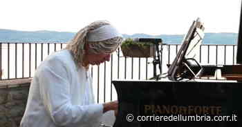 Passignano, il video del suggestivo concerto all'alba del maestro Mastrini - Corriere dell'Umbria