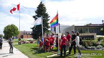 Steinbach LGBTQ community and supporters stage flag-raising demonstration at city hall - CBC.ca