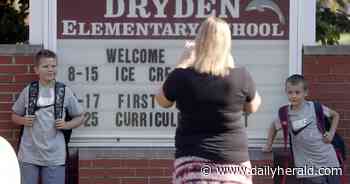 High-fives and hugs as students return to school in Arlington Heights