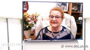 Holocaust activist seems to talk to guests at her funeral