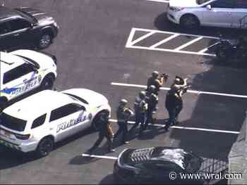 Police standoff: Officers with tactical gear and rifles near Garner High School
