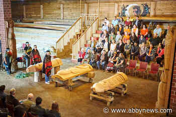 Three Indigenous house posts welcome guests to Abbotsford school district office