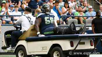 Seahawks' Lewis carted off; X-rays on ankle clear