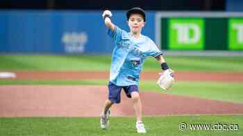 7-year-old Saskatoon heart surgery survivor throws first pitch at Blue Jays game - CBC.ca
