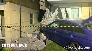 Dudley flats evacuated after car hits building - BBC