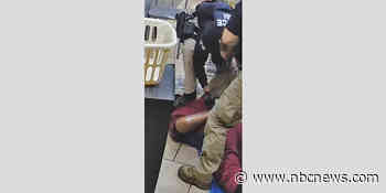 Video shows ICE agent with boot on the neck of migrant during workplace raid