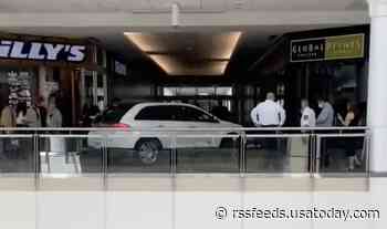 'Elderly' woman drives car onto second floor of mall, officers help her to back out