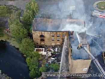 Blackburn road still closed after huge fire broke out at derelict mill