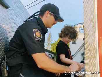 Firefighter gives youngster 'the same experience as any other child' through ASL truck tour