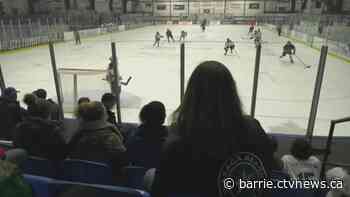 Students lace their skates for the 7th annual Hockey Day in Collingwood