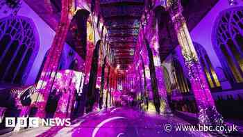 Hull Minster's interior illuminated in colourful light show