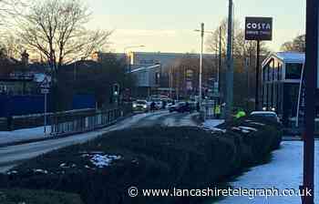 Armed police deployed and road closed in Accrington