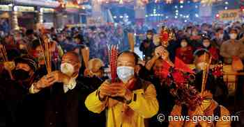 Chinese pray for health in Lunar New Year as COVID death toll rises - Reuters