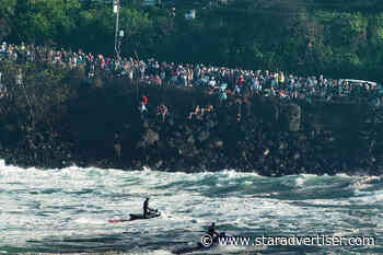 Lifeguards busy with rescues; baby swept under home during ‘Eddie’