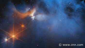 Webb telescope spies frozen molecules inside a wispy space cloud