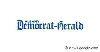 Jade Carey performs her beam routine - Albany Democrat-Herald