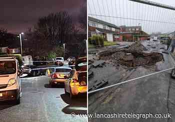 Police closed Cloister Drive after a car went down a sink hole