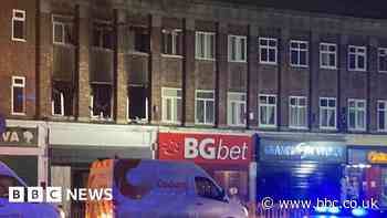 Radford: Crews remain after fire broke out above shop