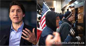 Justin Trudeau swarmed by group of 'angry' protesters as he walked into Hamilton restaurant