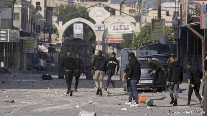 Palestinians say Israeli troops kill 9 in West Bank raid