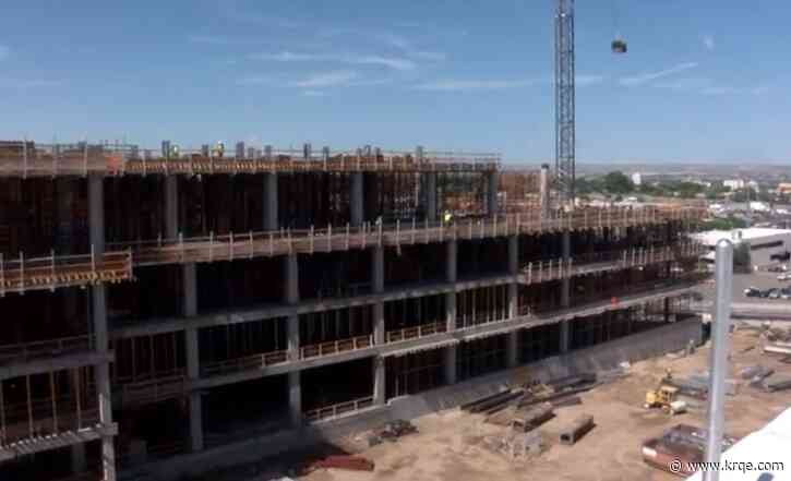 University of New Mexico Hospital staff sign final beams of new tower