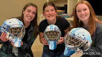Goalie friends on Team Alberta show off new helmets ahead of Canada Winter Games